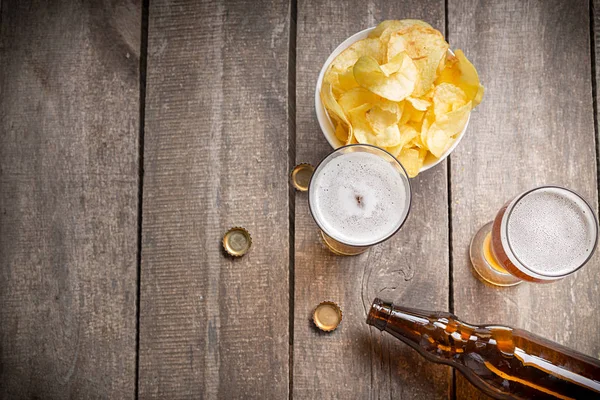 glass beer on wood background