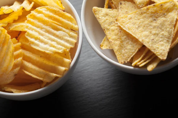 Potato chips in bowl on a table