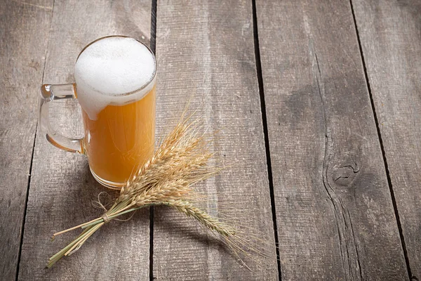 close up of  glass beer on wood background