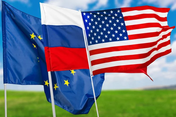 close up of Russia, USA and EU flags