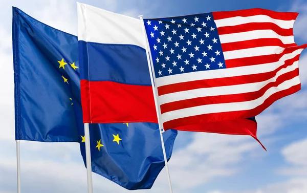 close up of Russia, USA and EU flags