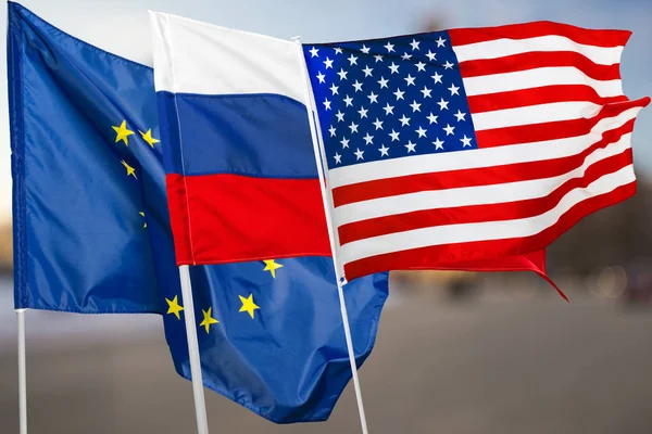 close up of Russia, USA and EU flags