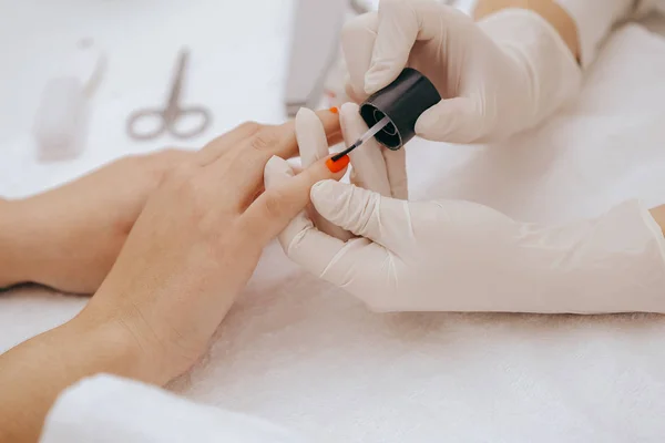 close-up of painting nails at beauty salon