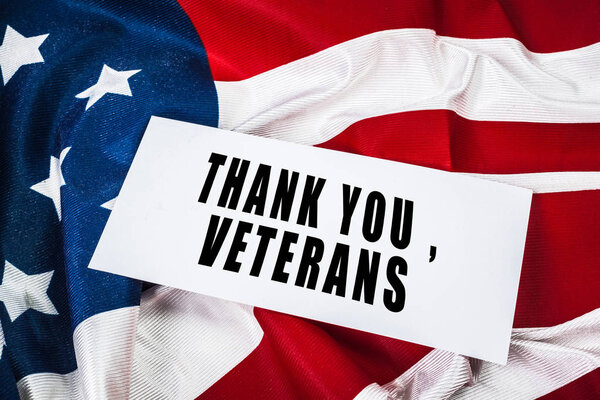 Veterans day greeting card on flag