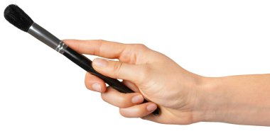 yüz fırça tutan el