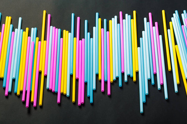 Close view of dozens of colorful drinking straws