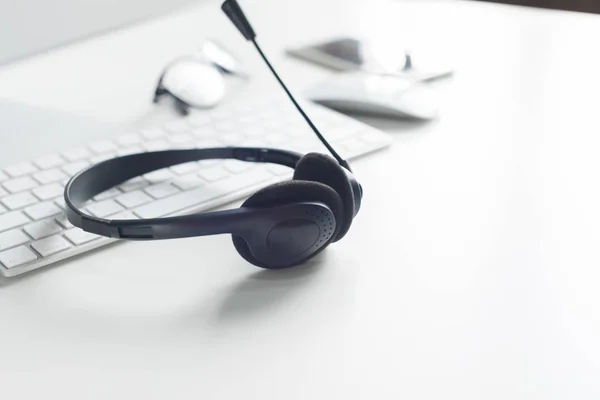 close up of  laptop computer with headset