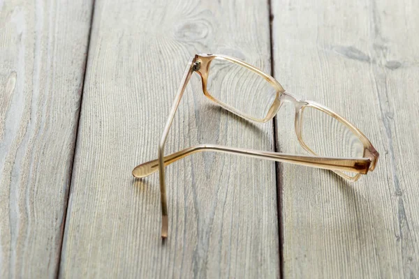 Gafas Graduadas Sobre Mesa Madera —  Fotos de Stock