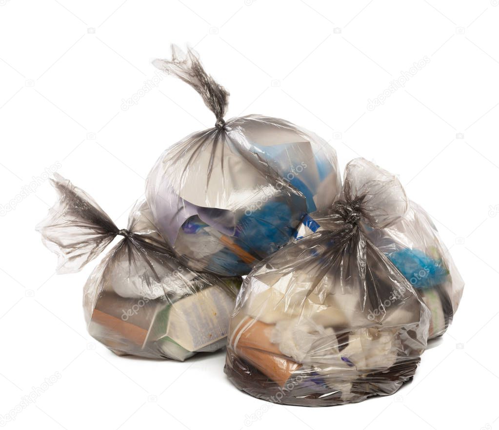 close up of Plastic bags full of rubbish on isolated white background