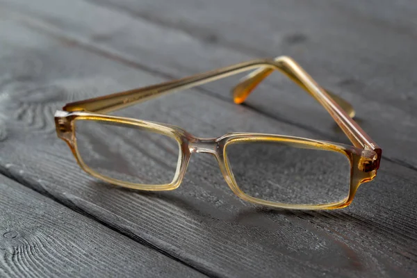 Gafas Graduadas Sobre Mesa Madera —  Fotos de Stock