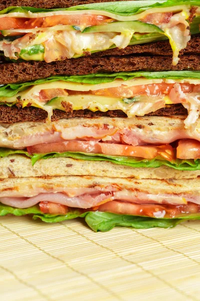 close up of Club sandwiches on wooden table
