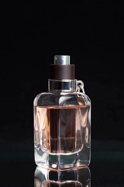 perfume bottle on a dark background