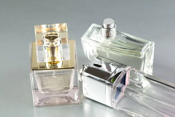 perfume bottles on a grey background