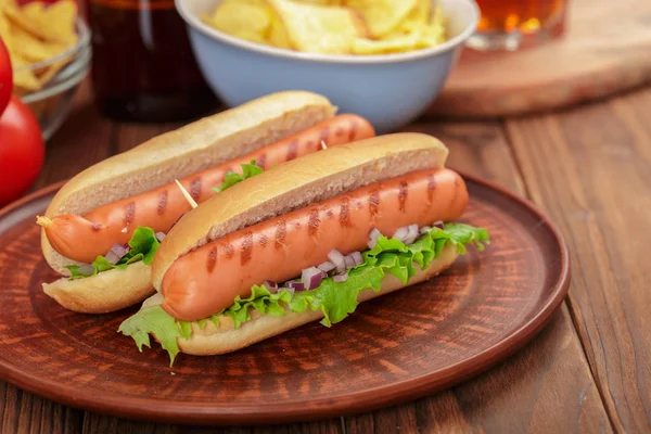 close up of Hot dogs on wooden background