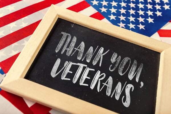 composite picture of veterans day with american flag