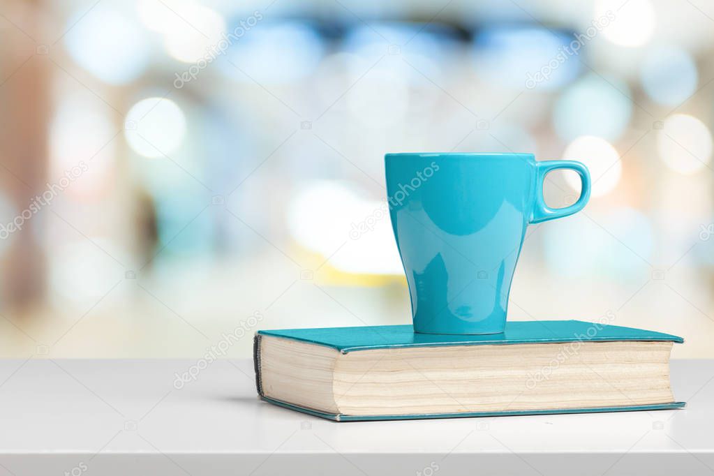 Tea or coffee mug on a table against blurred background
