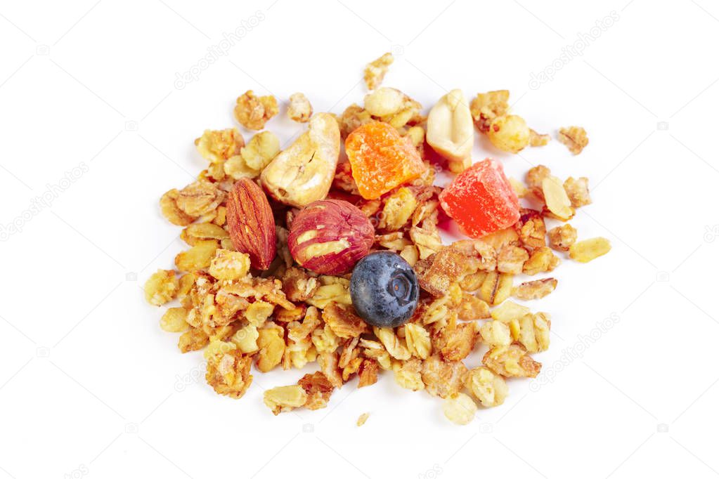 Granola with dried fruits isolated on white