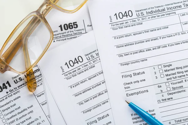 close up of filled Tax forms with pen
