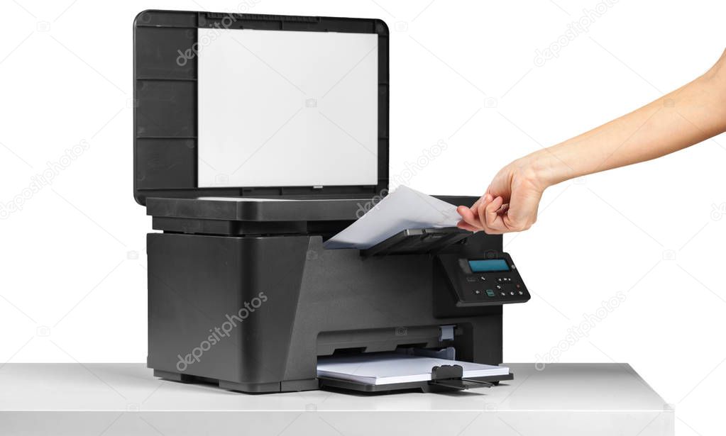 close up of person using moden printer on the table against white background 