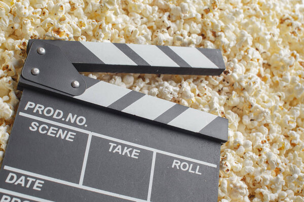 close up of  Movie Clapper Board in popcorn