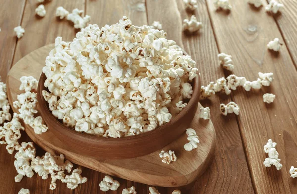 close up of Salt popcorn in the bowl  on the wooden table