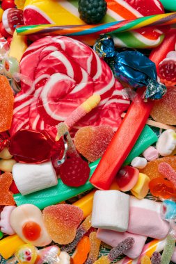 Farklı renkli meyve şekerleri arka planı kapat 