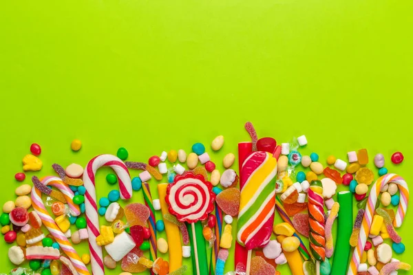 Colorful Candies Green Background — Stock Photo, Image