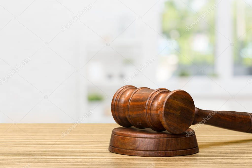 close up of Wooden gavel and books on wooden table 