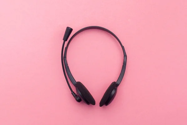 audio headset on color background