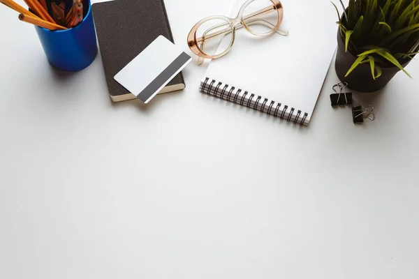 Business Items dropped in creative Disorder on white Table