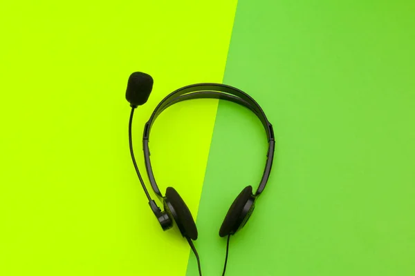 close up of audio headset on color background