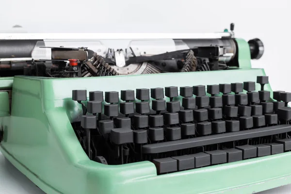 close-up of green vintage typewriter machine