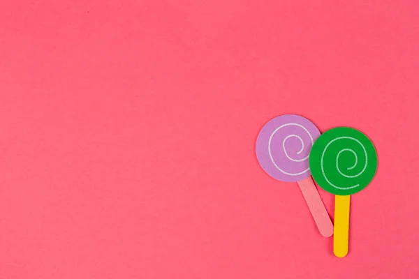 Papel Dulces Para Fondo Fiesta Lollipops Papel Sobre Fondo Rosa — Foto de Stock