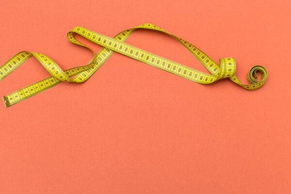 Yellow plastic measuring tape top view