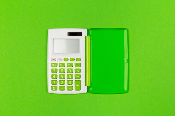 Шкільний Калькулятор Яскраво Зеленому Тлі Вид Зверху — стокове фото