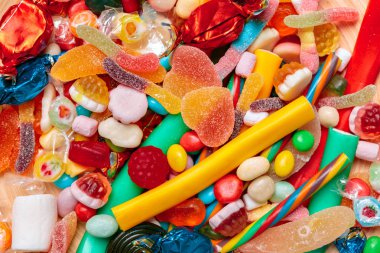 Farklı renkli meyve şekerleri arka planı kapat 