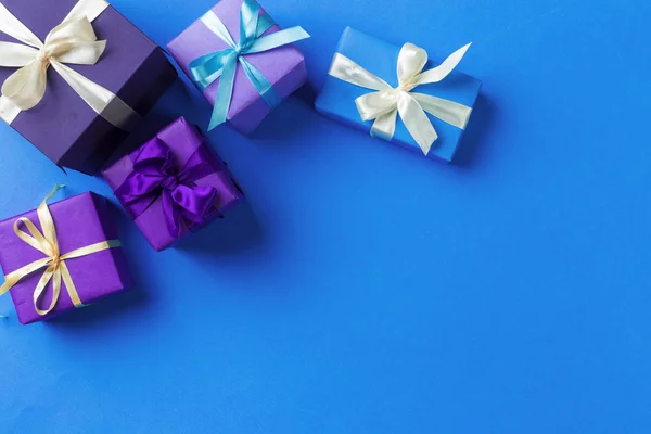 close up of gift boxes on colorful background