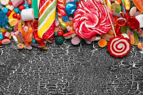close up of Colorful candies on old background