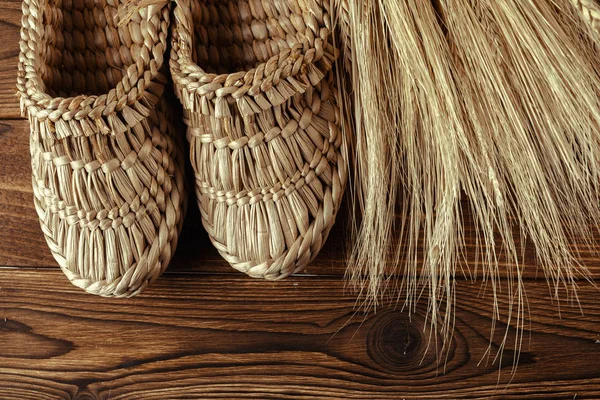 Old Bast Shoes Wooden Background — Stock Photo, Image