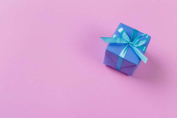 close up of gift box on color background