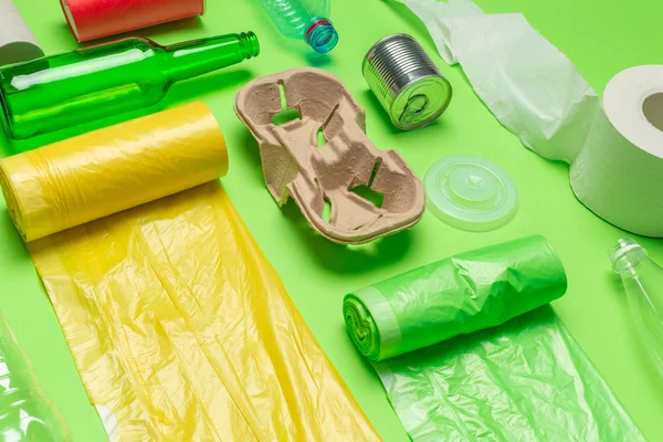 waste materials paper, plastic, polyethylene on colorful background