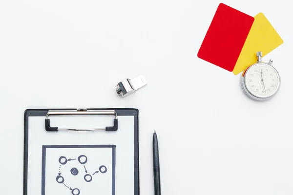 two penalty cards and a whistle for the referee