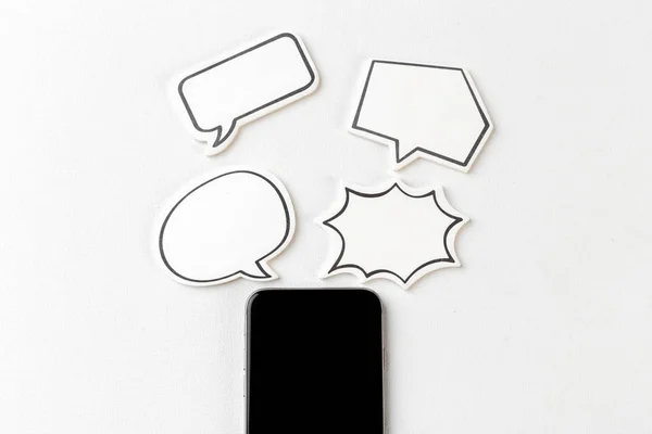 mobile phone with blank speech bubble