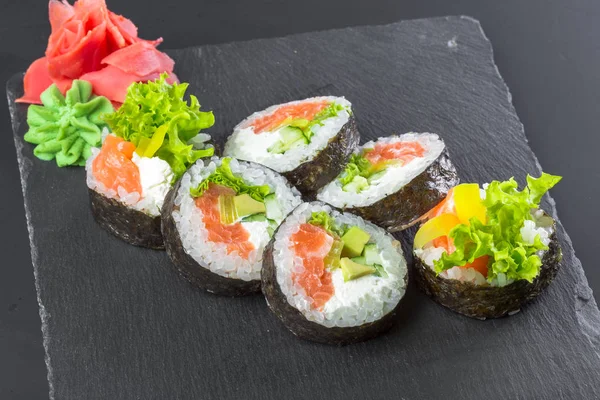 Tasty Sushi Rolls Black Slate Plate — Stock Photo, Image