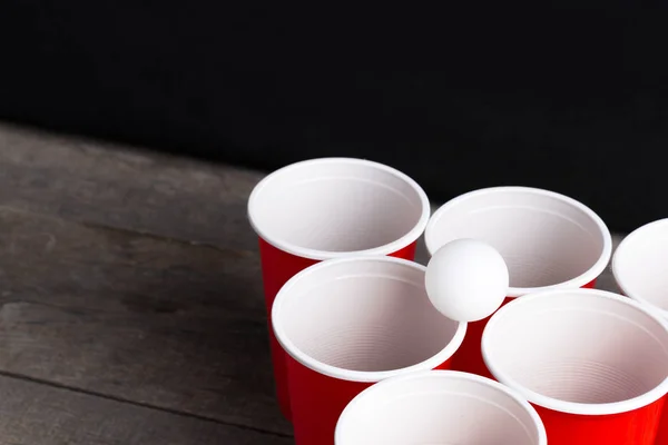 Game Beer Pong on wooden table