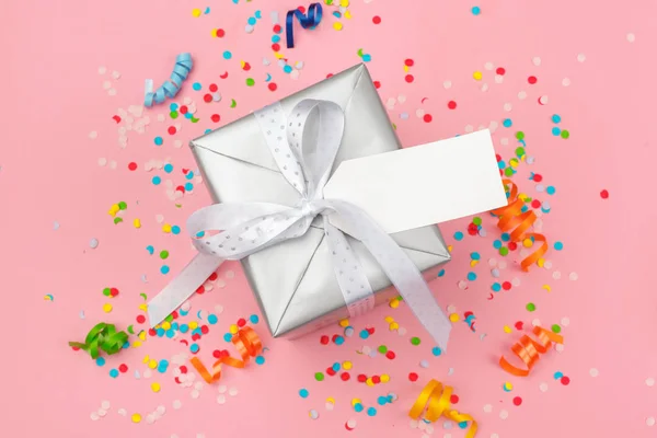 gift box with various party confetti, streamers and decoration