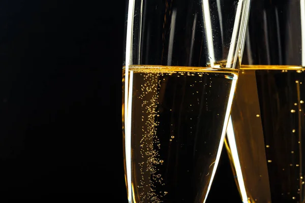 Champagne glasses for festive occasion against a dark background