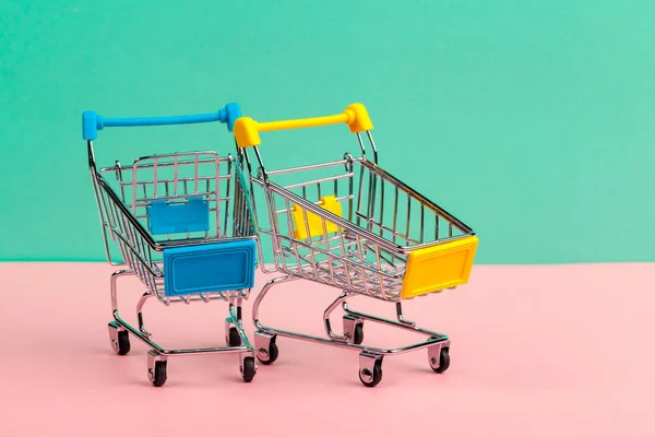 Mock up shoppong online cart on desk table office soft blue wall