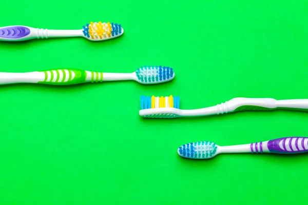 toothbrush on green background, dental care concept