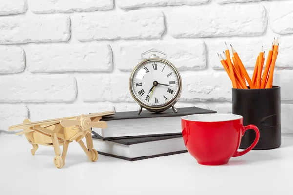 cup of tea and books on table